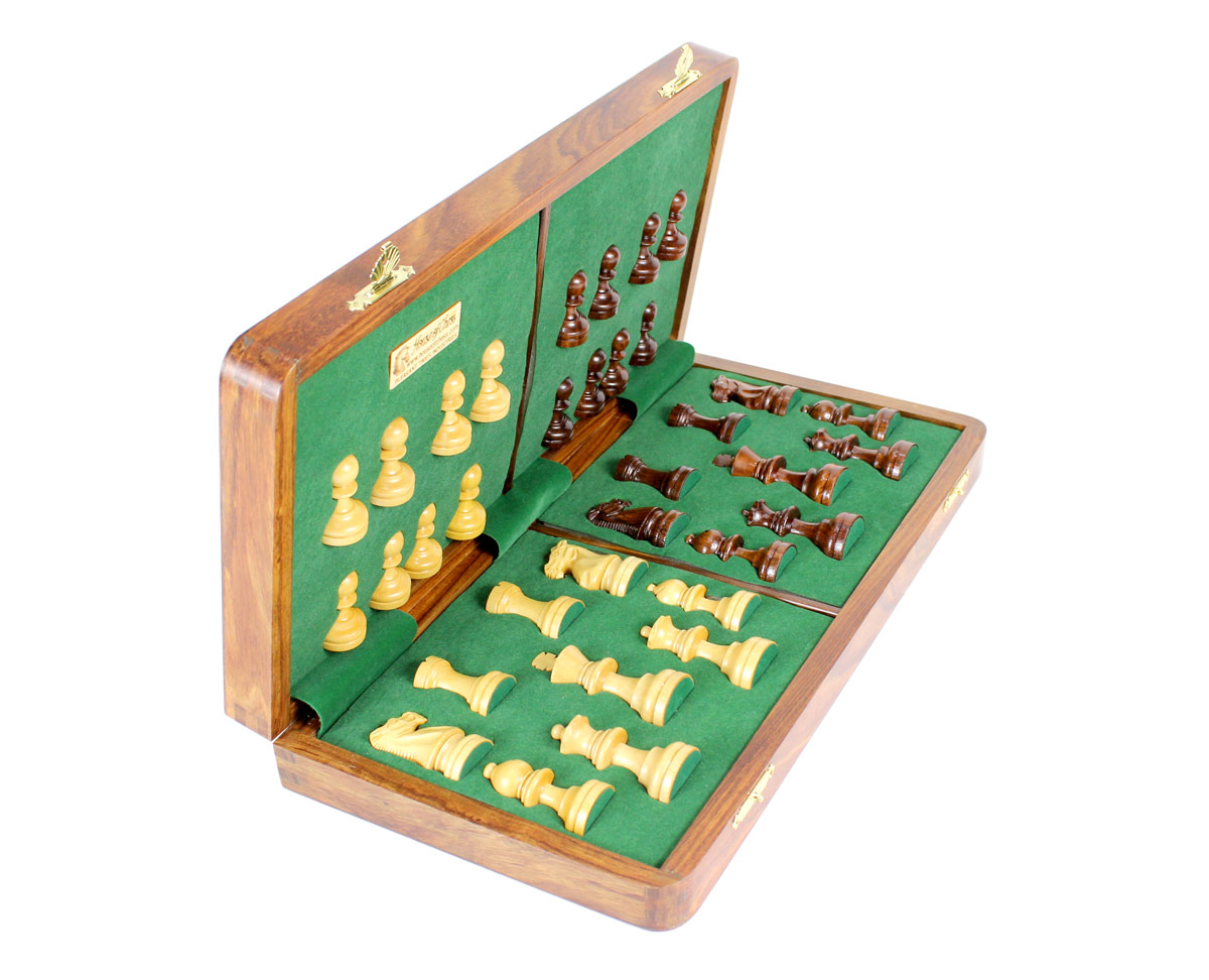 Chess pieces fitted in special inserts made according to the shape of the chess pieces.